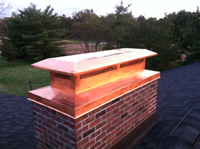 Before and after chimney cap replacement in Westbury, NY