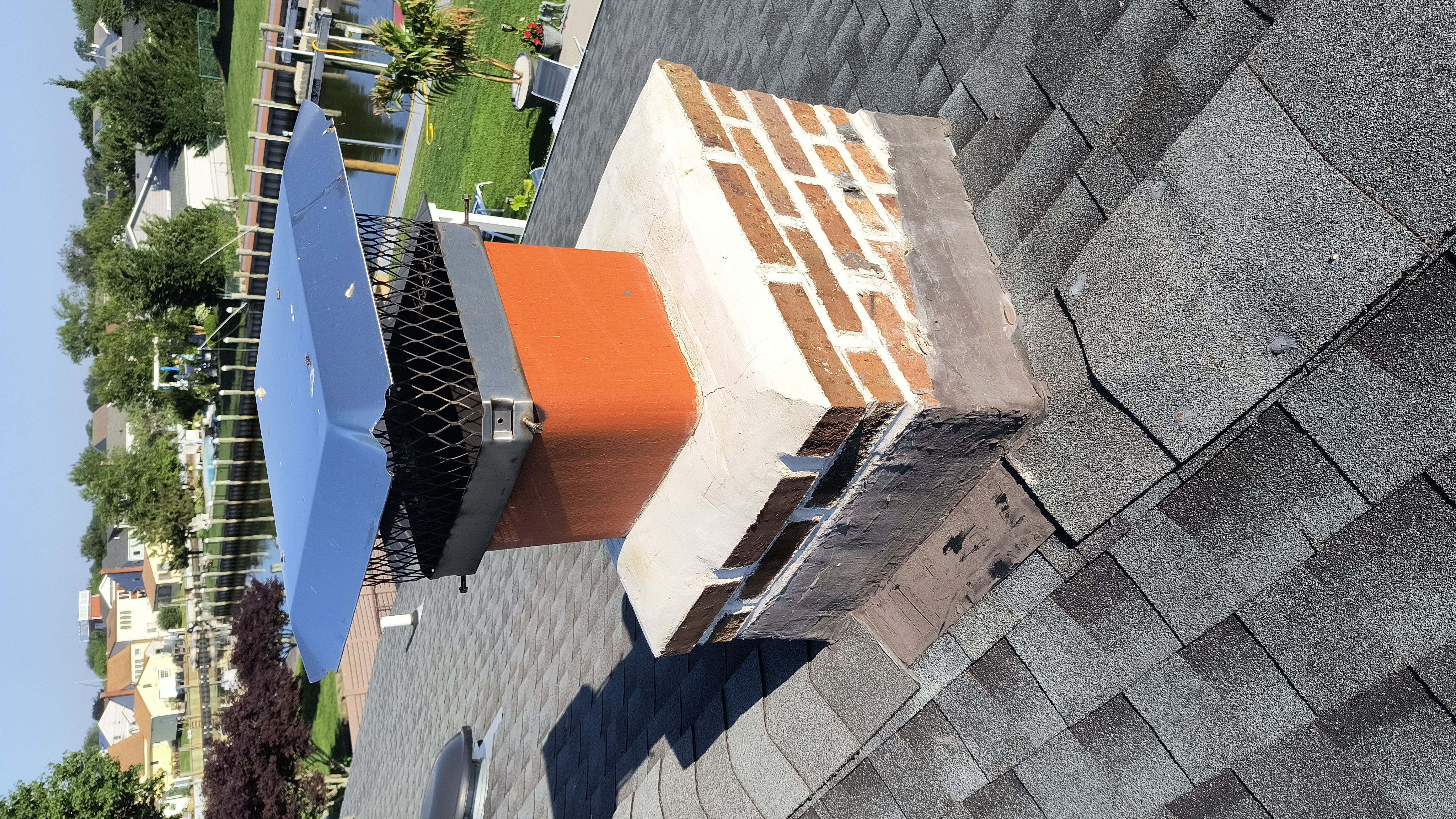 Full chimney masonry rebuild and restoration in Westbury, NY