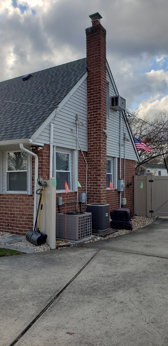 Professional chimney repointing restoring brick joints in Westbury, NY