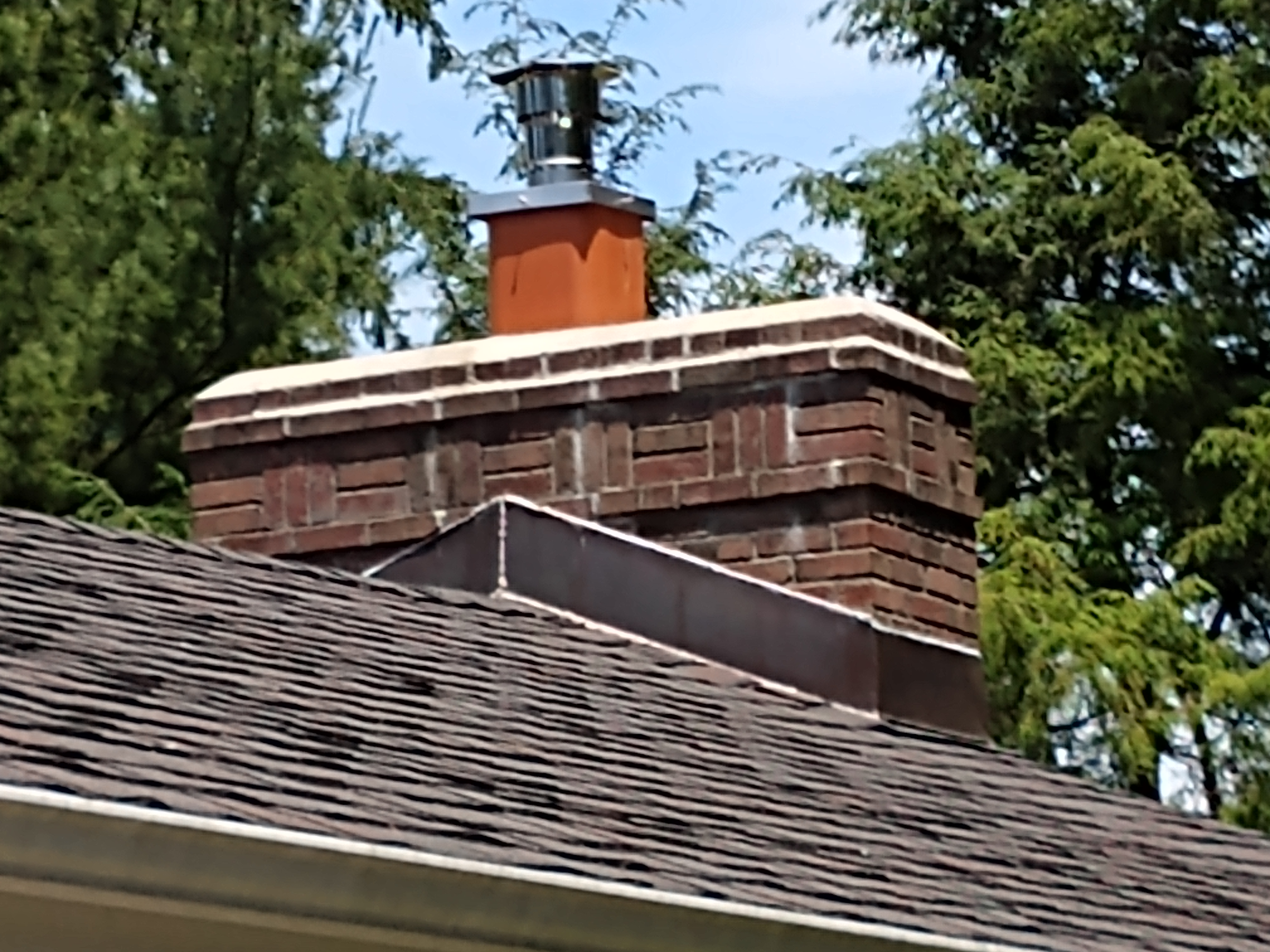 Stainless steel chimney cap with animal guard in Westbury, New York